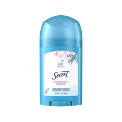 Secret Wide Solid Pwdr Fresh bottle on bathroom shelf for daily freshness.