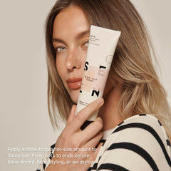 SEEN Blow-Out Creme frizz-control on damp strands promotes sleek finishes.