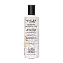 Close-up of SEEN Shampoo lather on hair, showcasing gentle cleansing