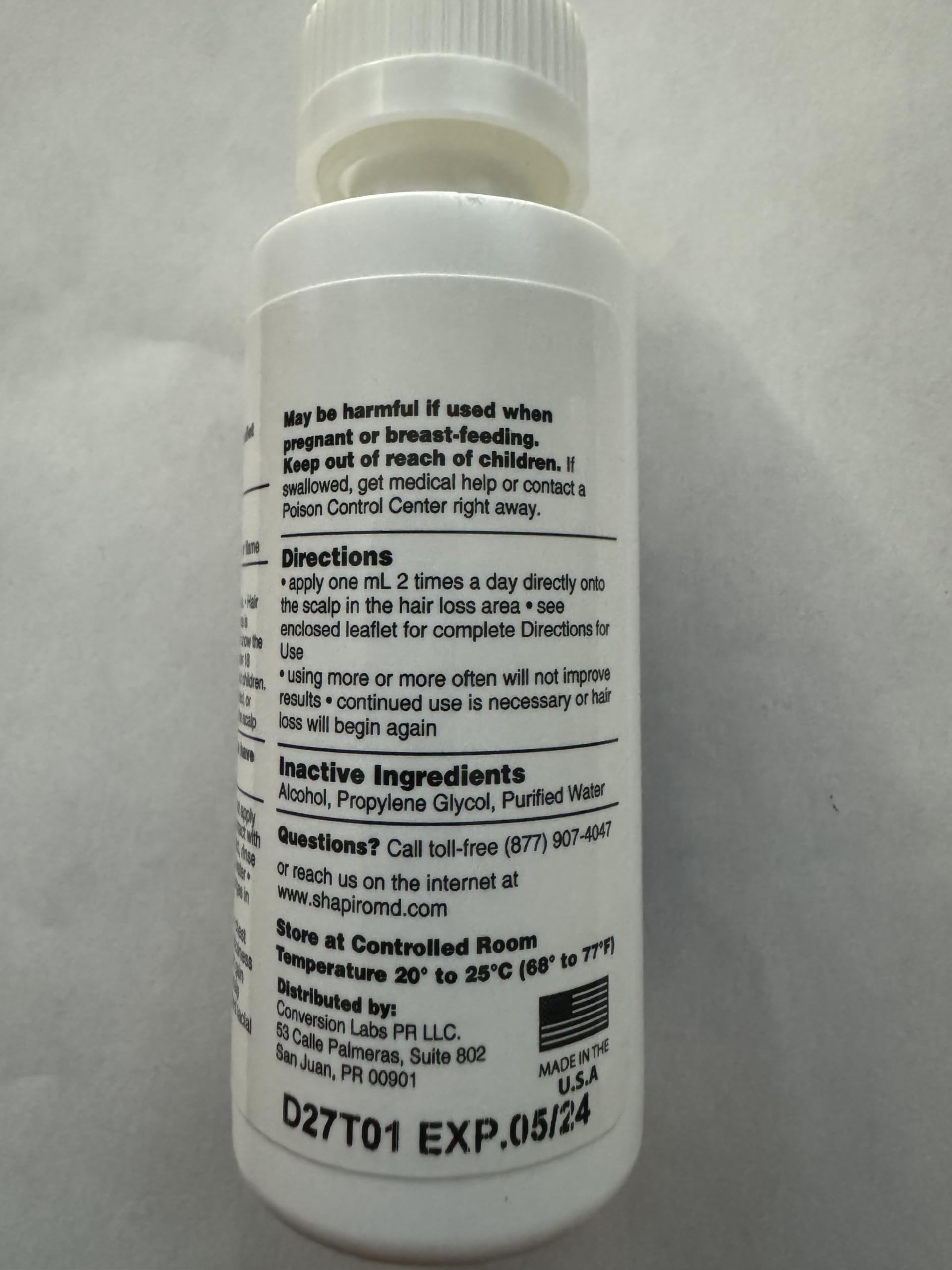 Storage of Shapiro MD Minoxidil bottle in a medicine cabinet
