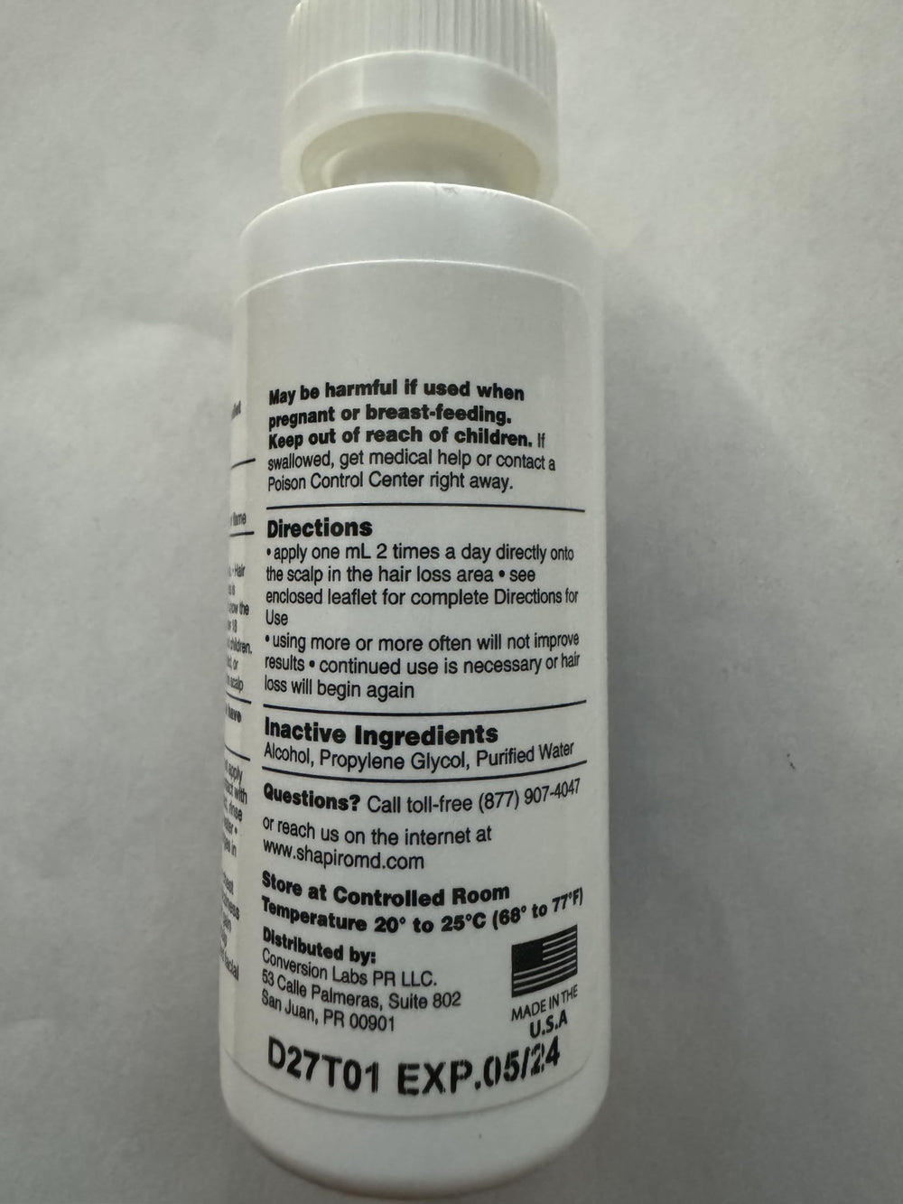 Storage of Shapiro MD Minoxidil bottle in a medicine cabinet
