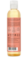 SheaMoisture Coconut & Hibiscus oil on skin showing smooth glow.