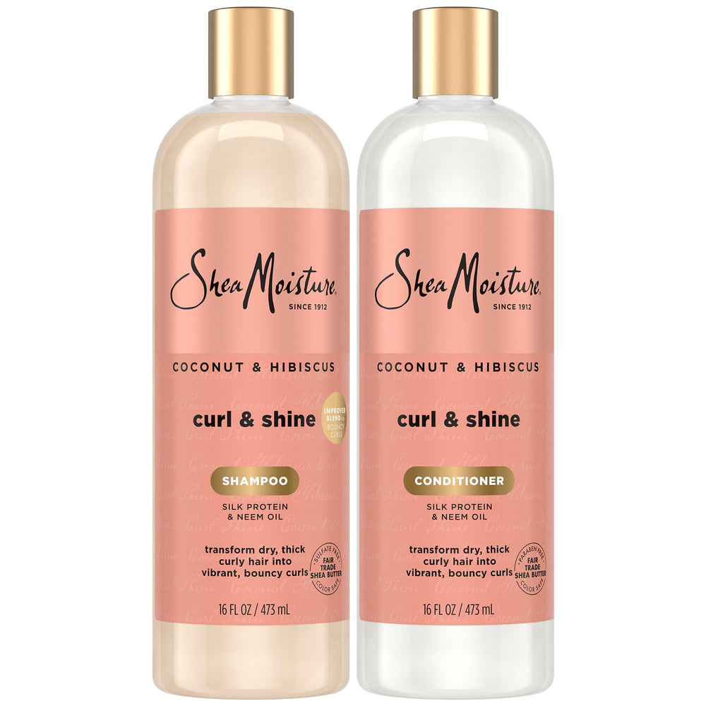 SheaMoisture Coconut & Hibiscus shampoo bottle pouring for frizz control and hydration