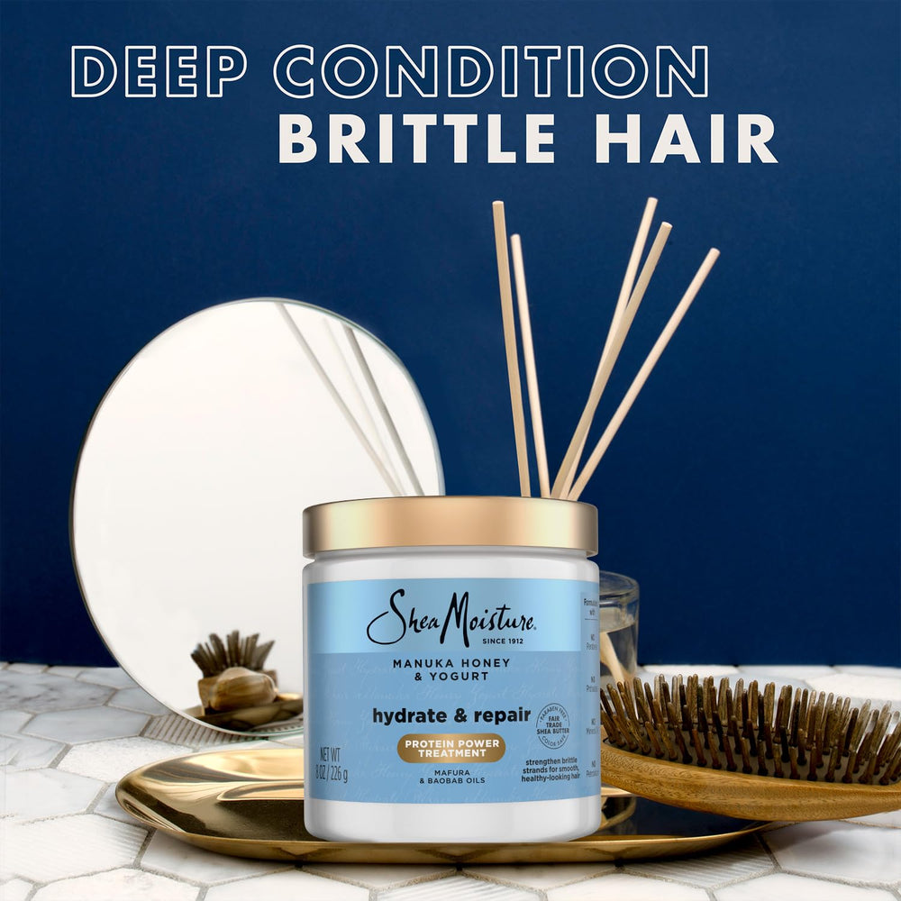 SheaMoisture Hair Mask creamy spread on wet hair for repair.