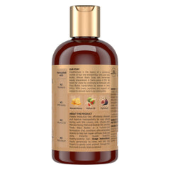 SheaMoisture Hair Milk being massaged through damp hair for conditioning.