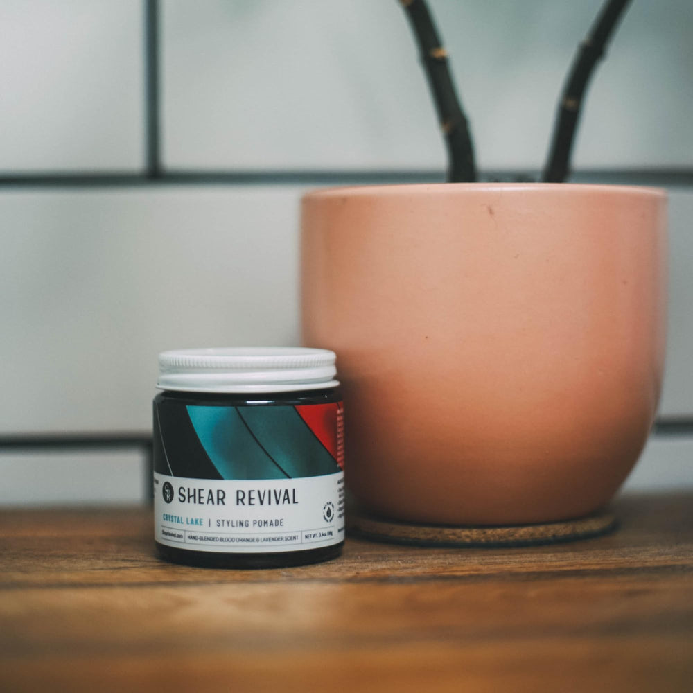 Shear Revival Crystal Lake pomade hands rubbing, highlighting easy application for textured looks