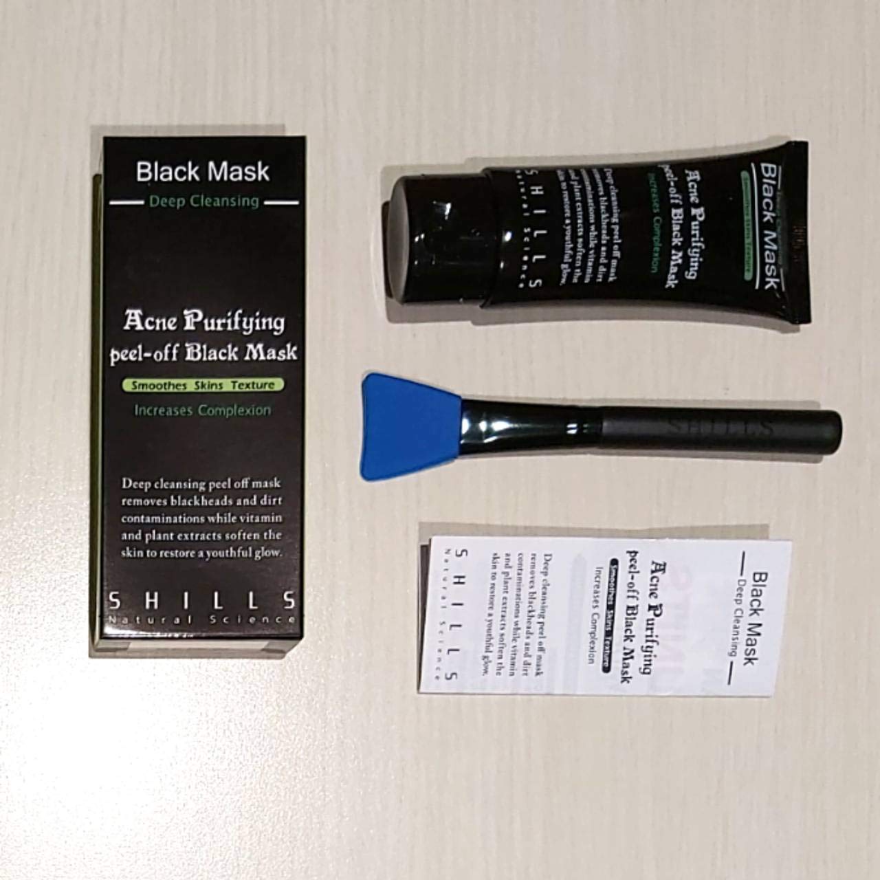 SHILLS charcoal mask rinse-off near water to reveal smoother skin