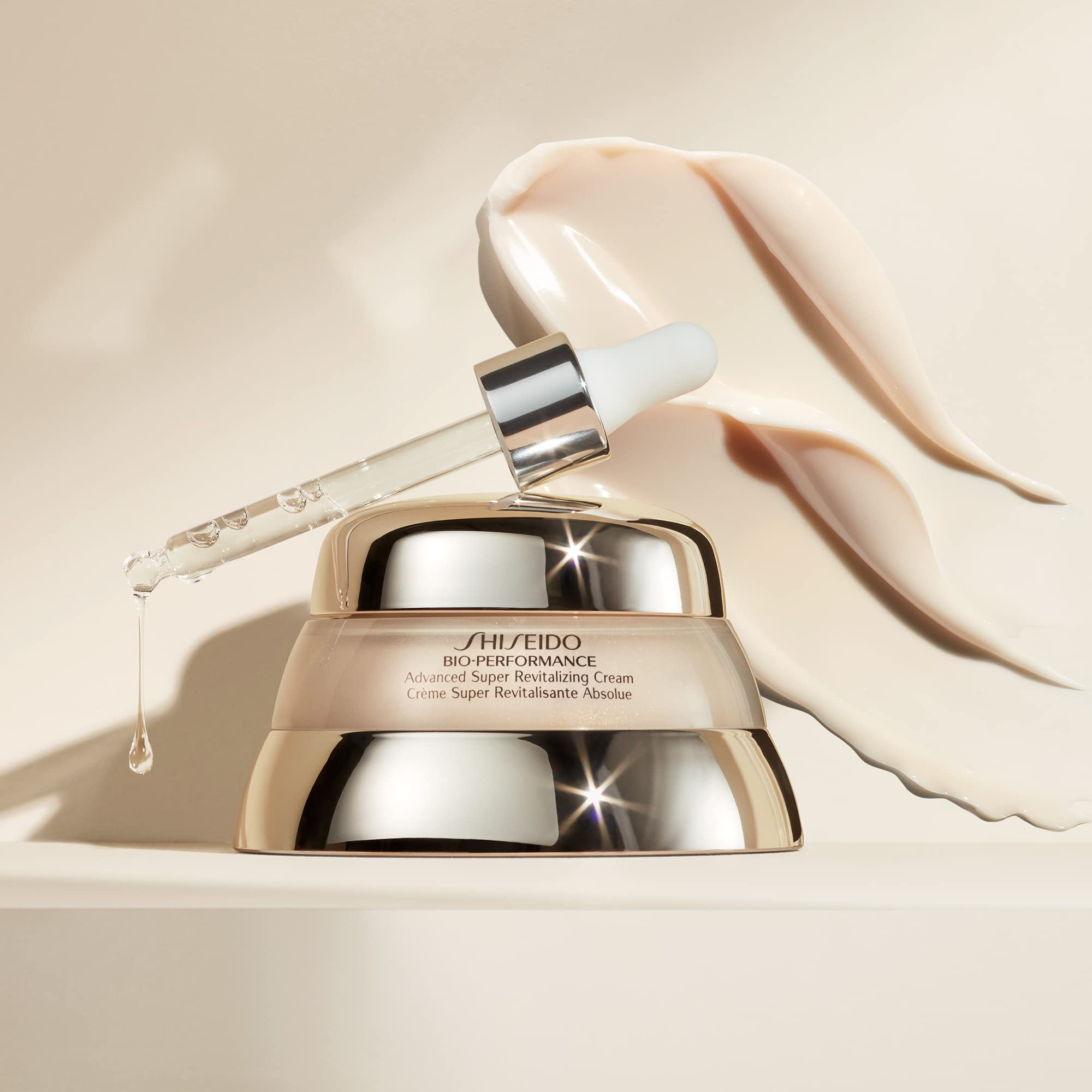 Shiseido Bio-Performance cream on fingertips showing quick absorption