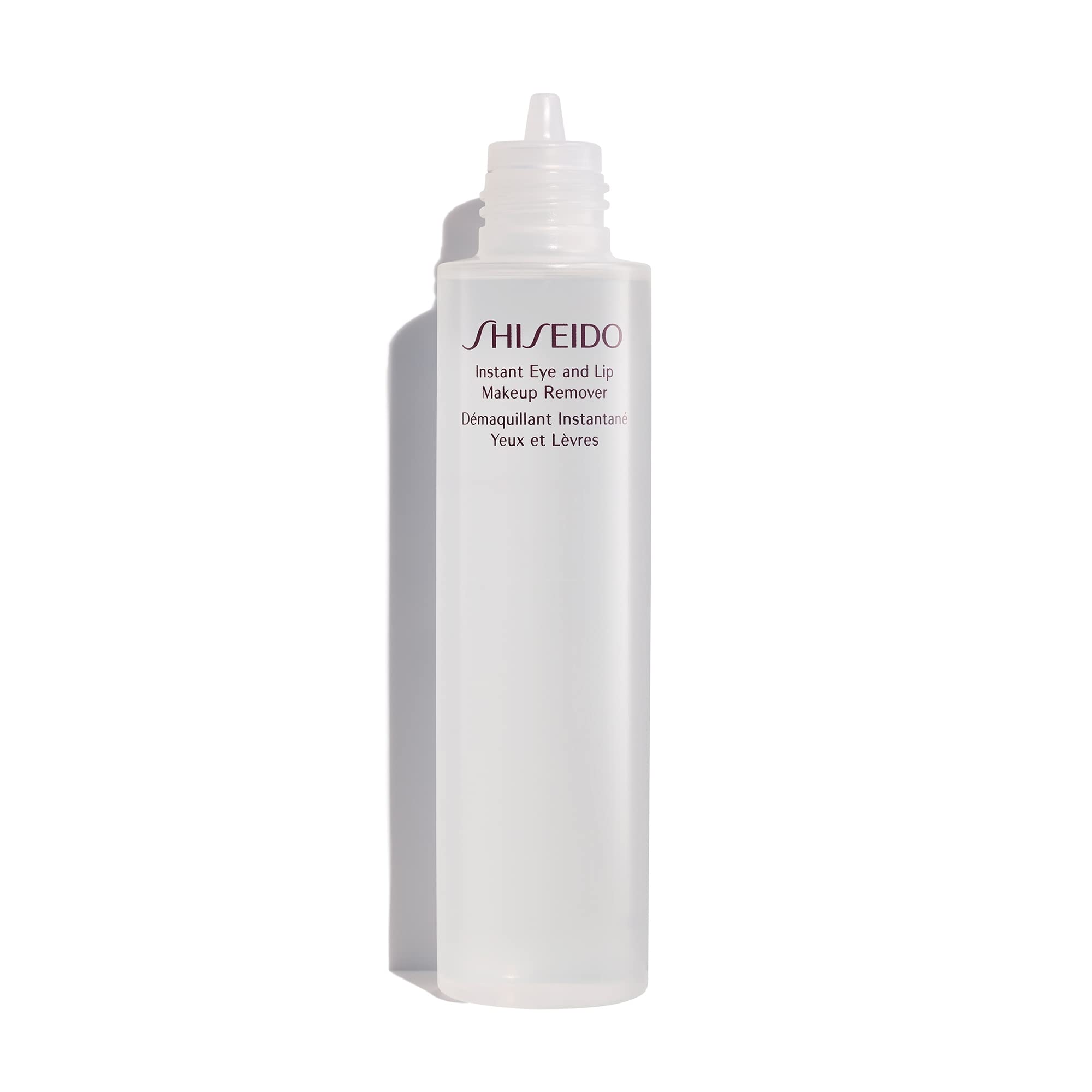 Shiseido Instant Eye & Lip Makeup Remover cotton pad lifting long-wearing makeup gently.
