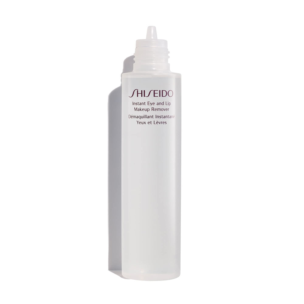 Shiseido Instant Eye & Lip Makeup Remover cotton pad lifting long-wearing makeup gently.