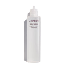 Shiseido Instant Eye & Lip Makeup Remover cotton pad lifting long-wearing makeup gently.