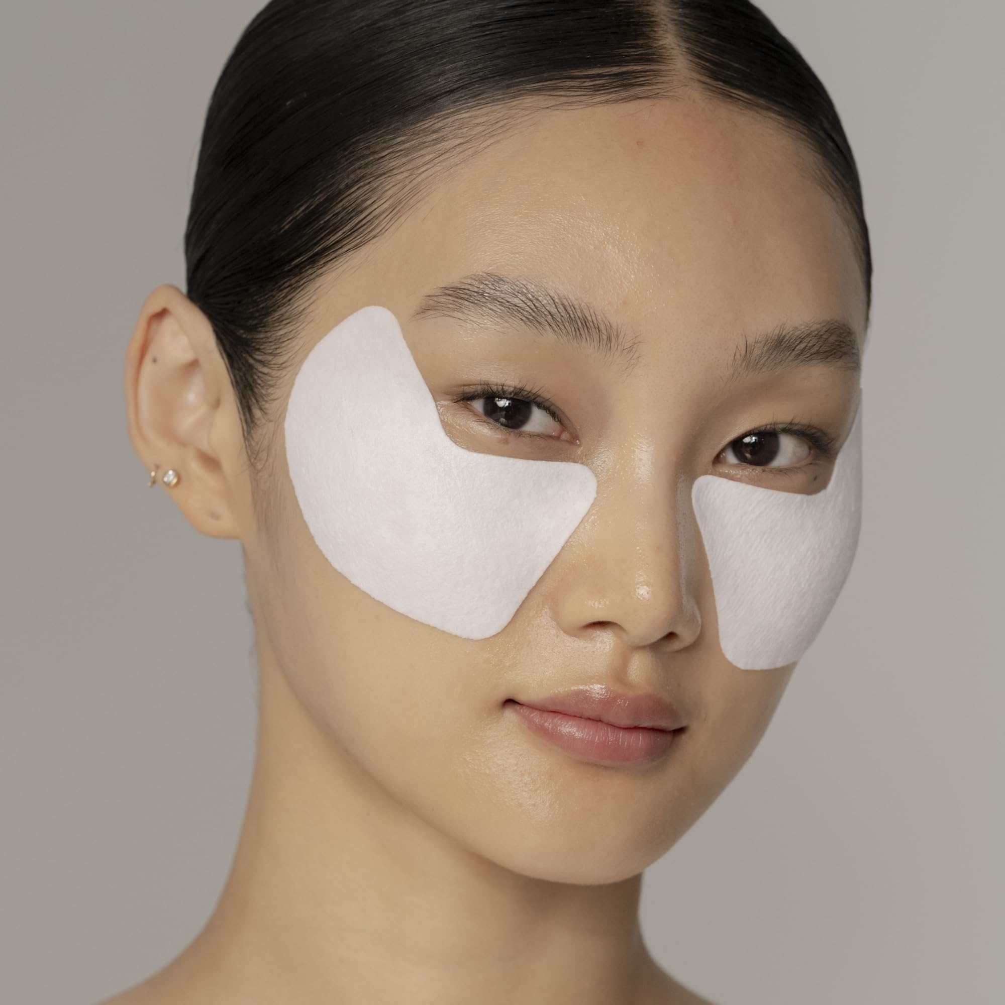 Shiseido Vital Perfection eye mask application closeup shows lift-ready fit