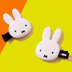 SHOBIDO Miffy die-cut bangs clip side view holds bangs in place during routines.