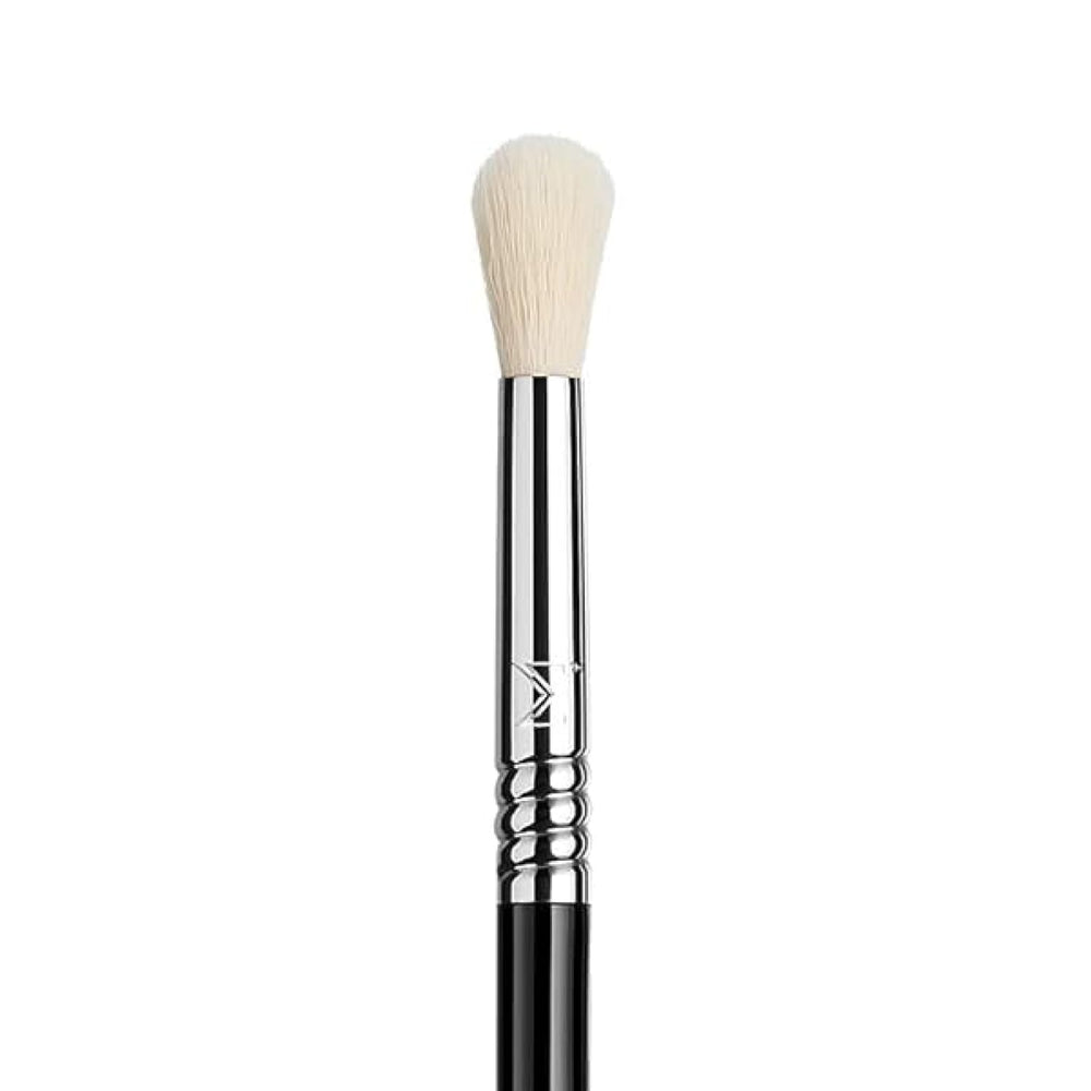 Sigma Beauty E35 demonstrates precision blend strokes for targeted crease shading.