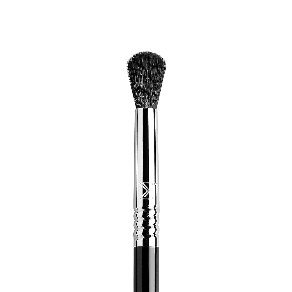 Sigma Beauty E38 fluffy blending brush for even lid pigment diffusion.