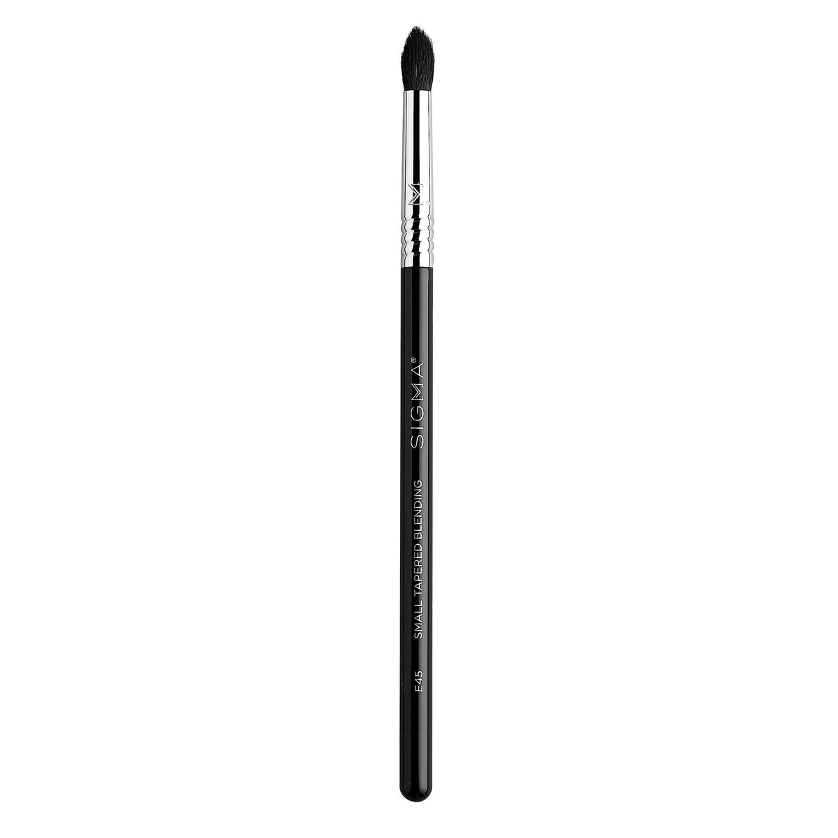 Sigma Beauty E45 small eyeshadow brush with pointed tip enables precise color blending for crease work.