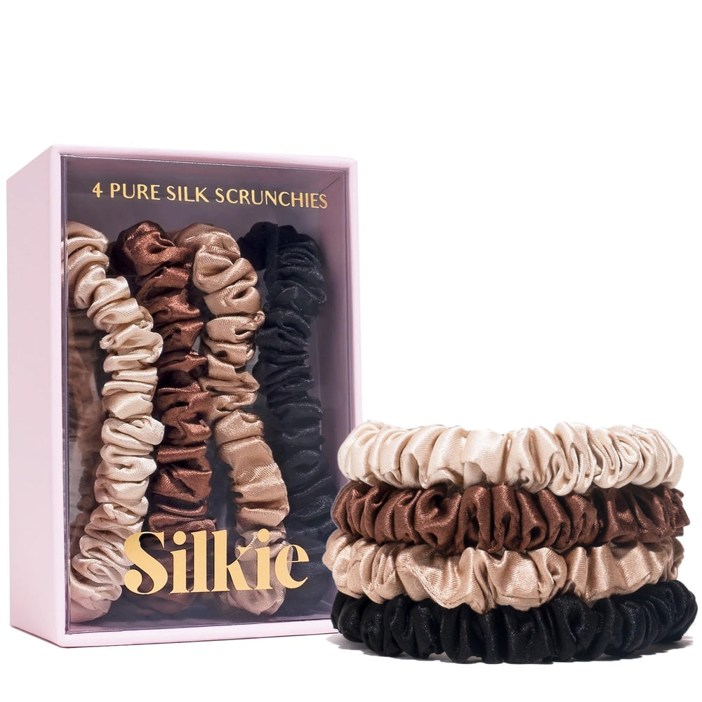 Silkie Mulberry silk scrunchies in chocolate packaging signal premium, snag-free hair care.