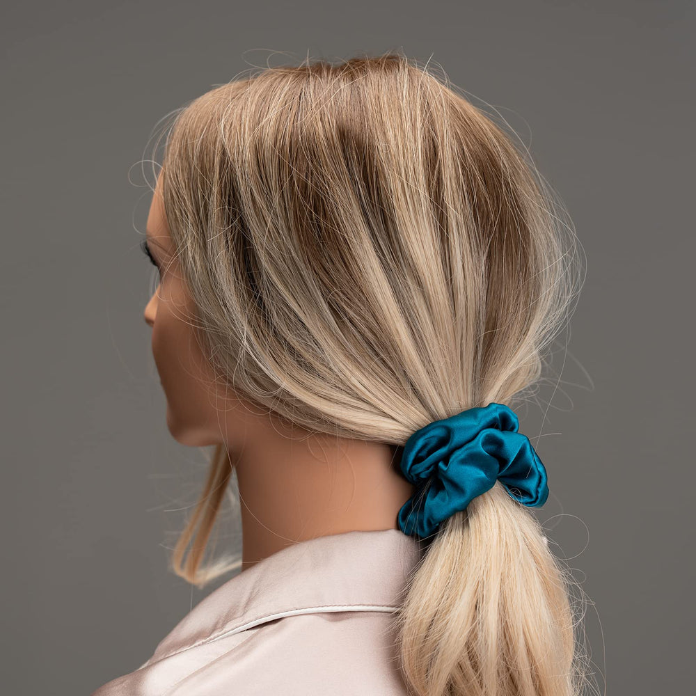 Silmer Silk Scrunchies apricot closeup, demonstrating smooth low tension hold.