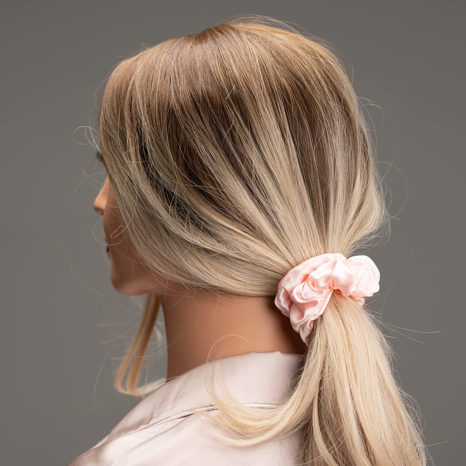 Silmer Silk Scrunchies pack hand elastic, showing strong yet soft grip.