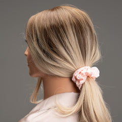 Silmer Silk Scrunchies pack hand elastic, showing strong yet soft grip.