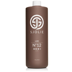 SJOLIE Sunless Luxe 12 bottle front view highlighting violet-based formula for even bronze.