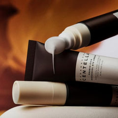 Creamy texture of SKIN1004 eye cream on fingertip ready for application near eyes.