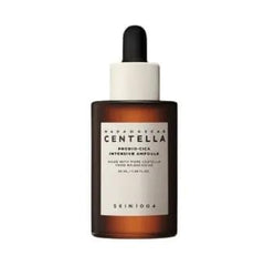 Applying SKIN1004 Probio-CICA Essence Toner to a cotton pad for gentle use
