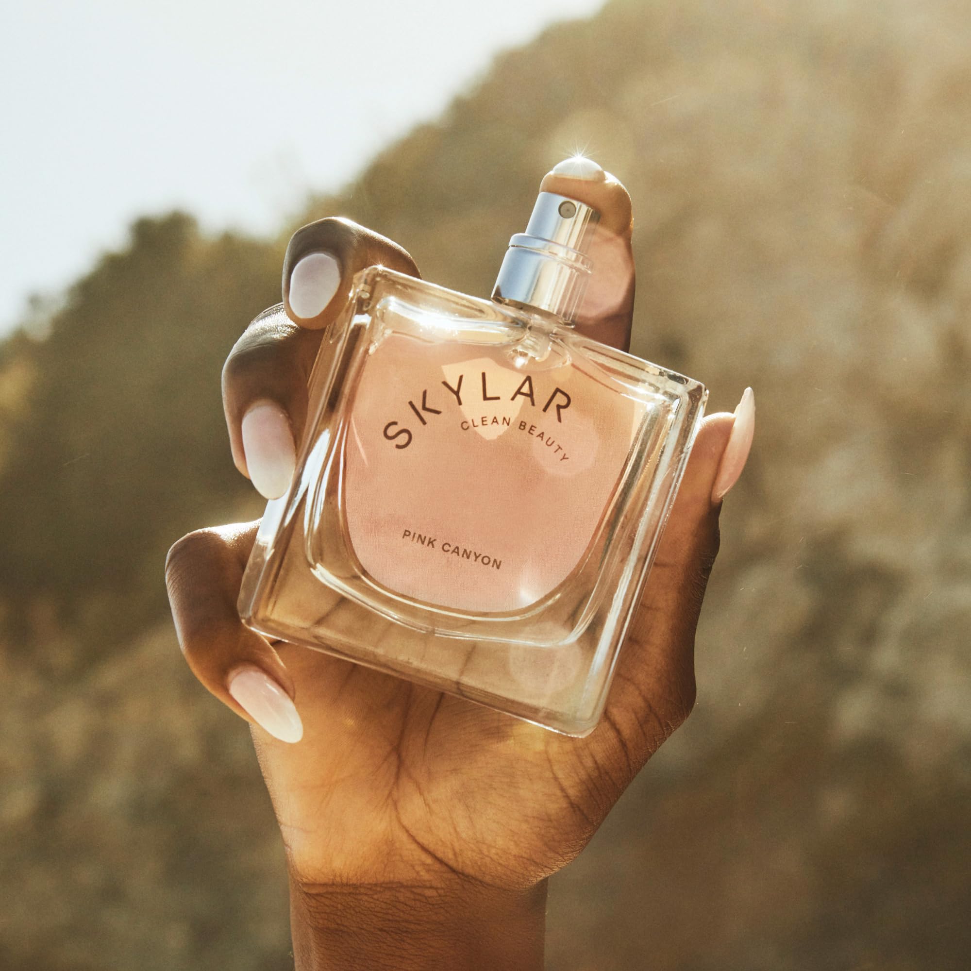 Skylar Pink Canyon ingredients graphic showcases grapefruit and cedar notes for uplifting mood.