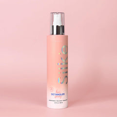 Sleek'e Hair Silk'e Detangler Spray bottle for easy brushing and frizz control.