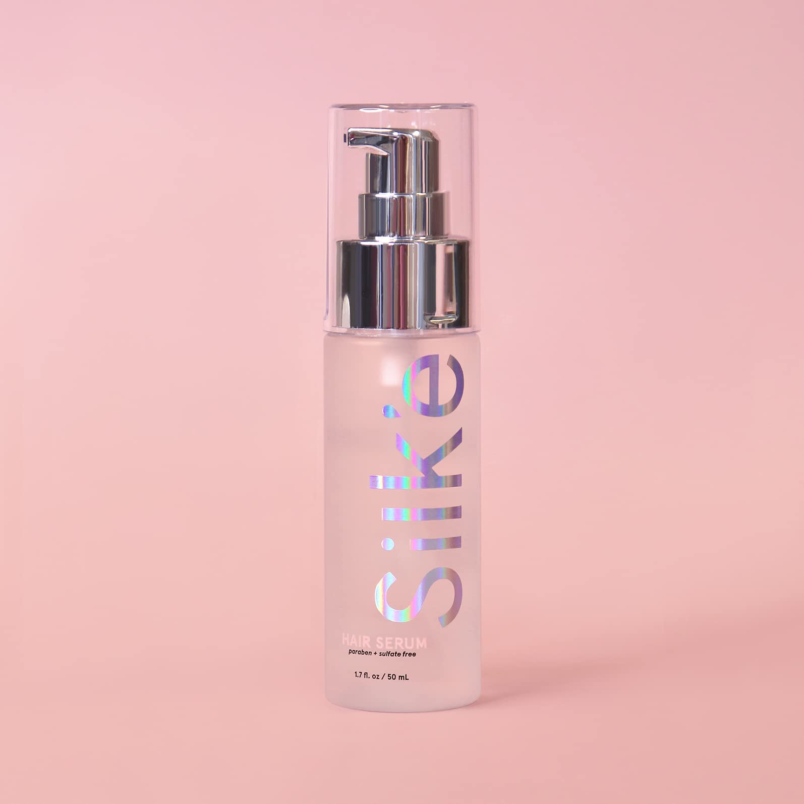 Sleek'e Silk'e Hair Serum dispense-pump-action shot highlights easy application.