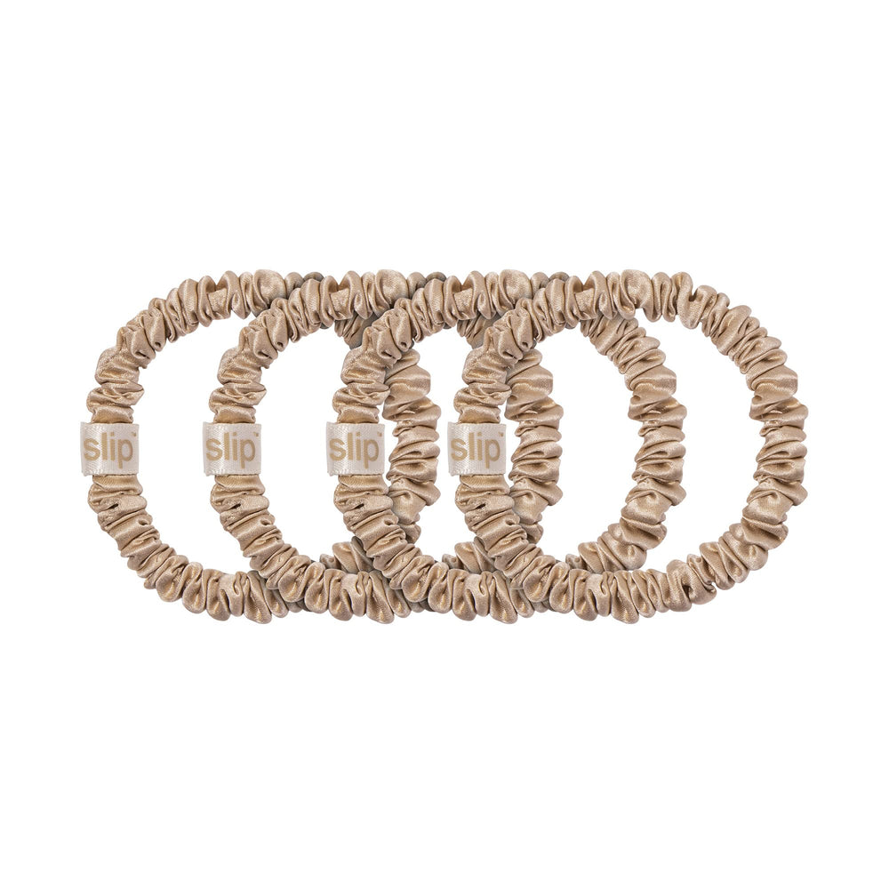 Slip Silk Skinny Scrunchies blonde hands-holding image emphasizes soft texture and luxurious feel.