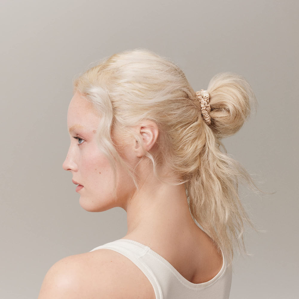 Slip Silk Skinny Scrunchies blonde model ponytail demonstrates sleek, crease-free styling with secure hold.