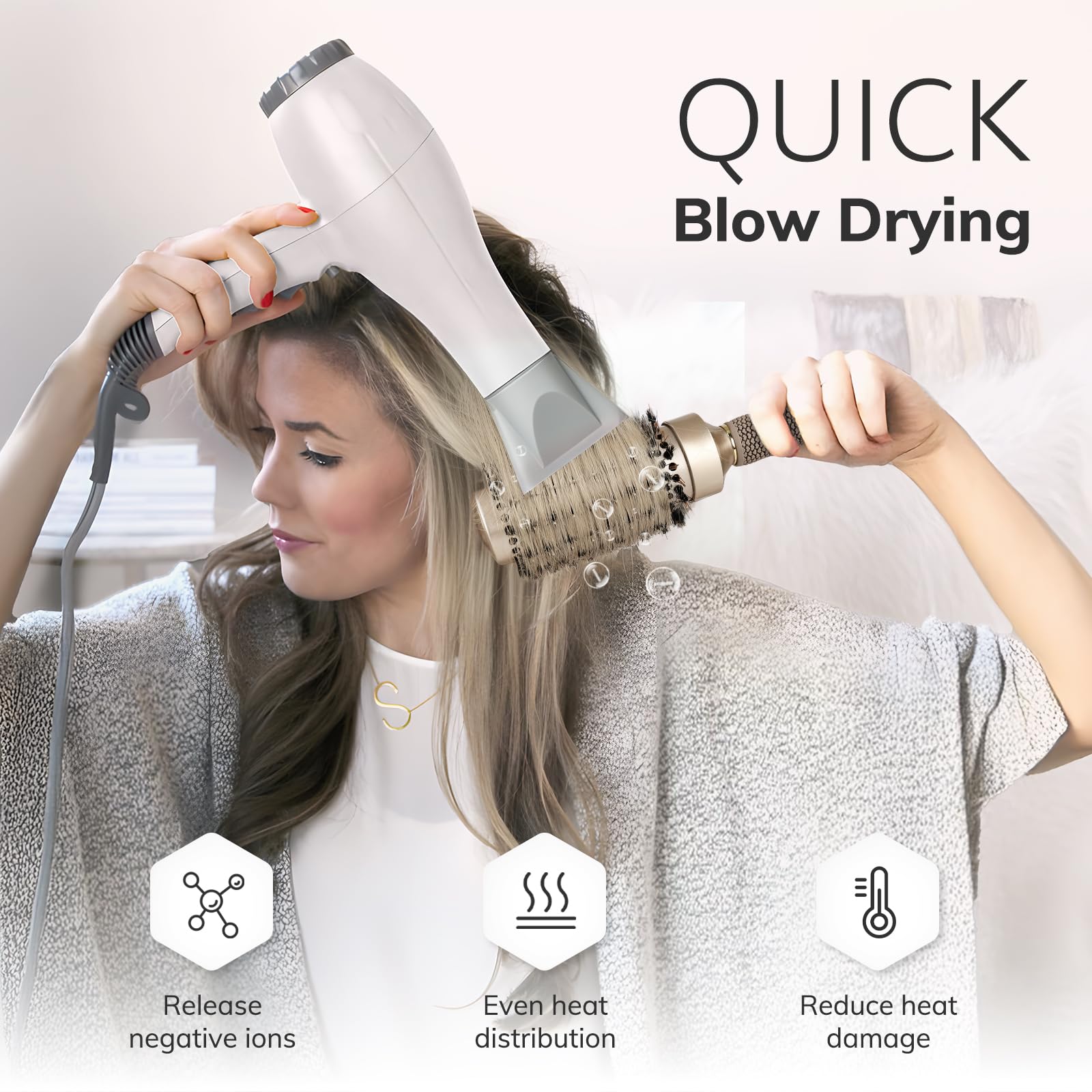 Sndyi round brush-anti-slip-handle shows secure grip during styling.