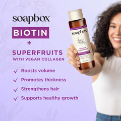 Soapbox Biotin Shampoo pump-action shot emphasizing nourishing plum oil