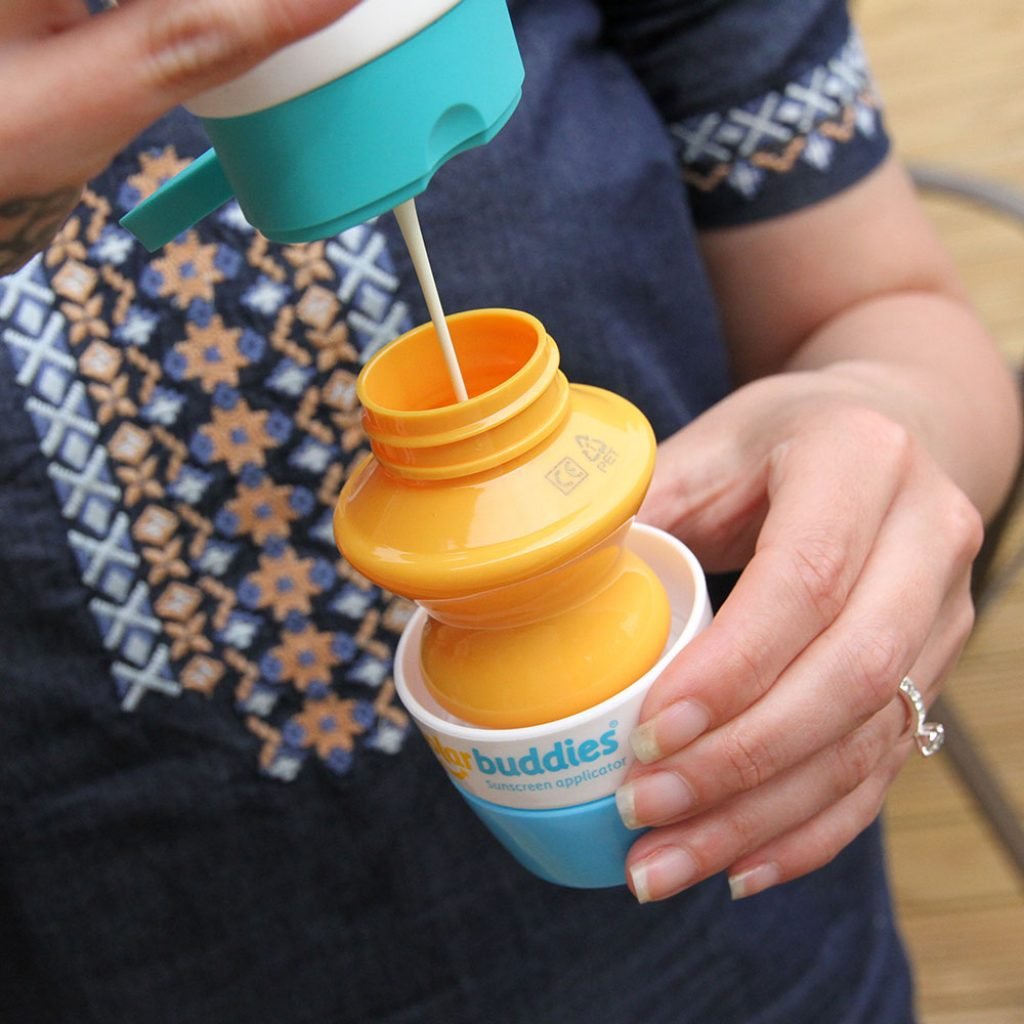 Solar Buddies sunscreen applicator blue travel-size fits bags for on-the-go protection.