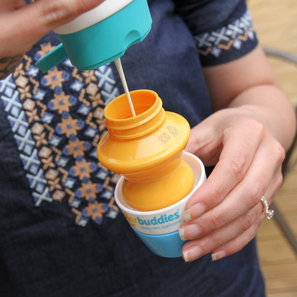 Solar Buddies sunscreen applicator blue travel-size fits bags for on-the-go protection.