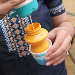 Solar Buddies sunscreen applicator blue travel-size fits bags for on-the-go protection.
