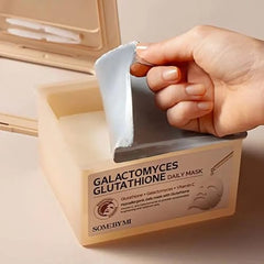 SOME BY MI Galactomyces Glutathione Daily Mask sheet on hand shows hydrating feel.