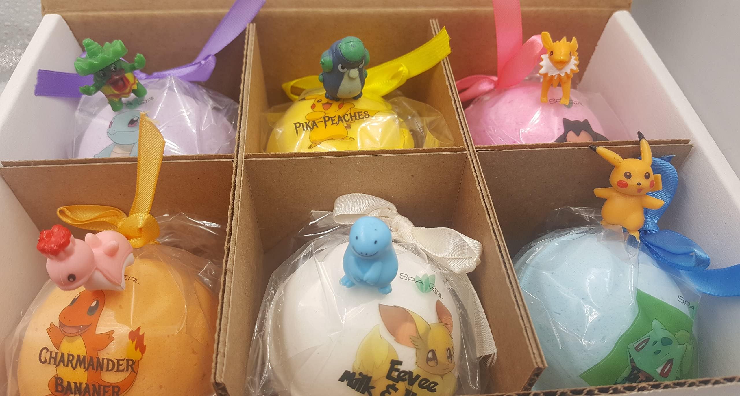 Spa Pure bath bomb packaging highlights 6 count and toy inside.