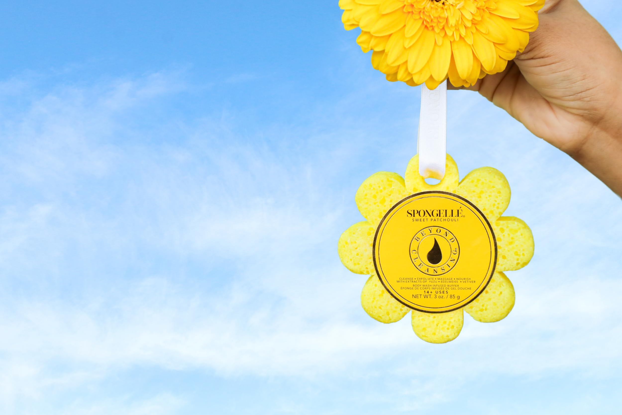 SPONGELLÉ Sweet Patchouli Wild Flower loofah with handle for easy scrubbing.
