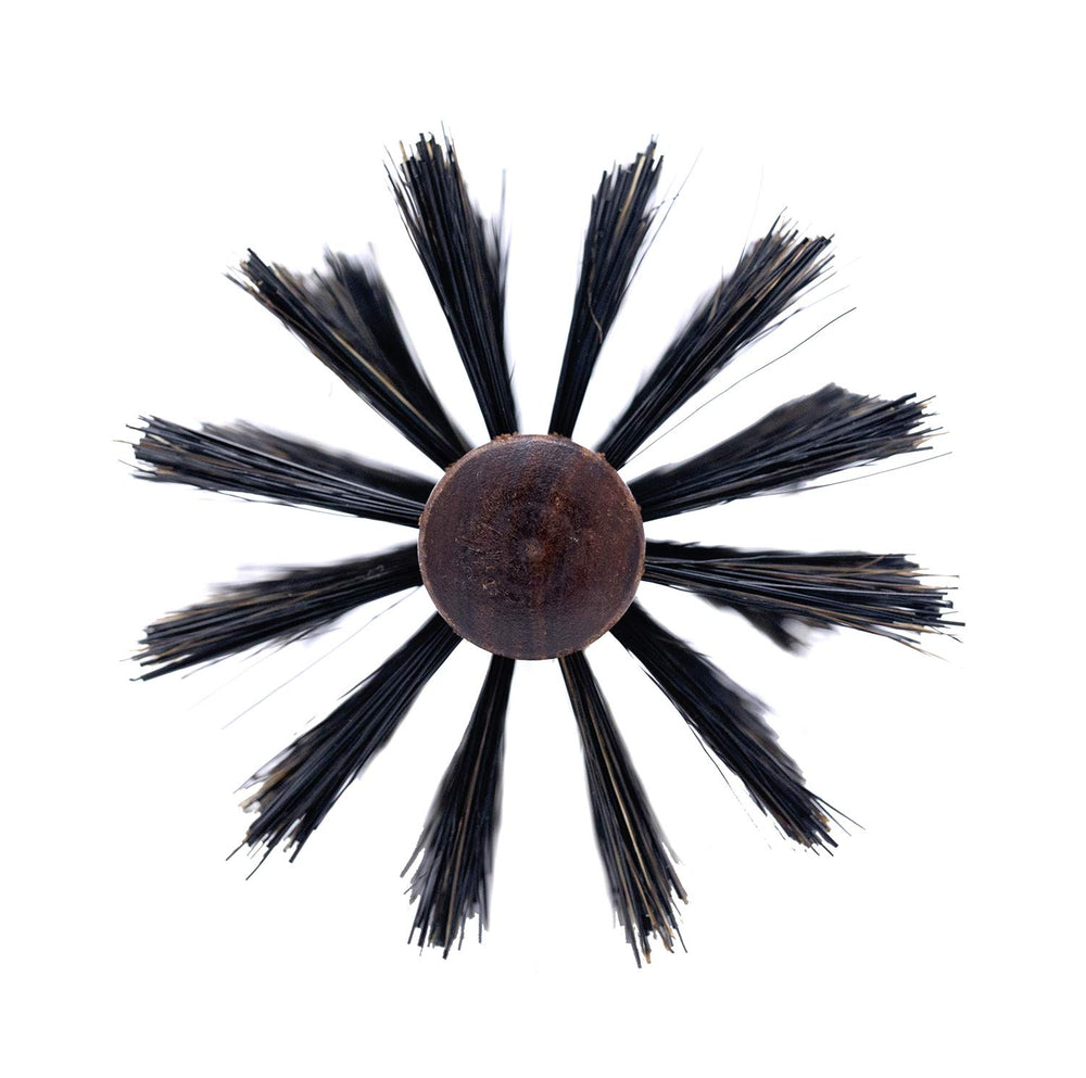 Spornette Italian Rounder in use with blow dryer for smooth, voluminous results.