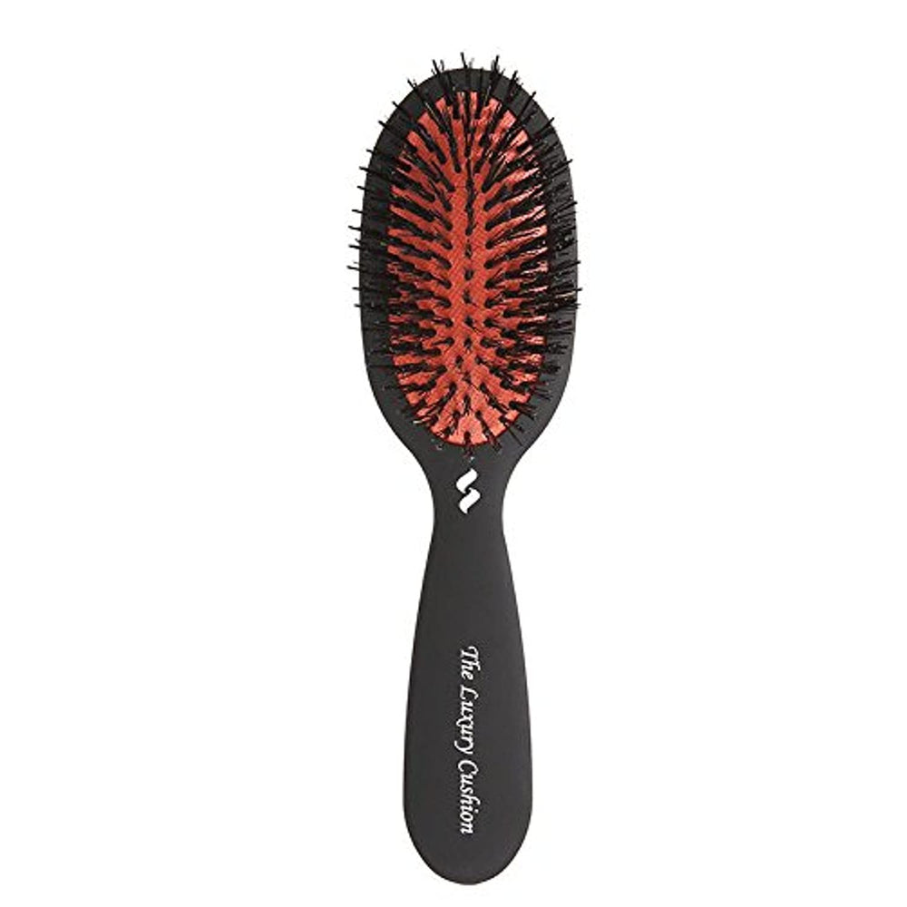 Spornette small luxury cushion oval brush in use for travel detangling all hair types