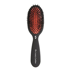 Spornette small luxury cushion oval brush in use for travel detangling all hair types