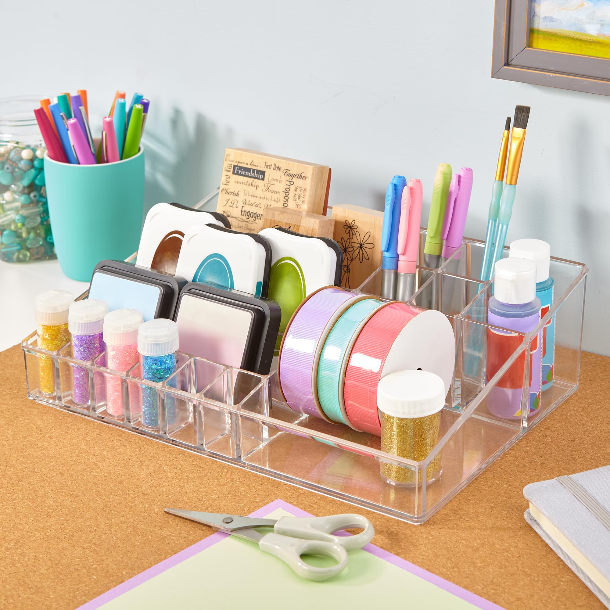 STORi Audrey clear vanity organizer filled with brushes on a dresser keeps makeup within reach.