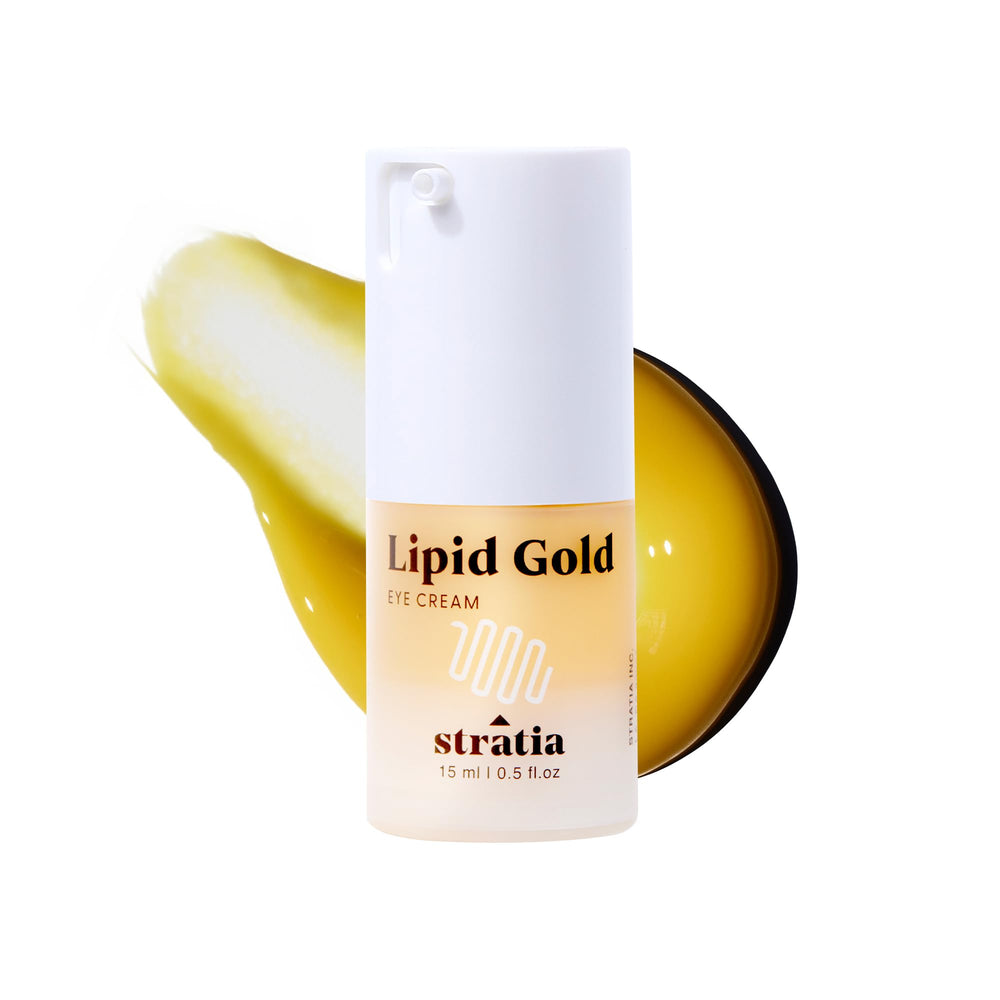 Stratia Lipid Gold Eye Cream jar closeup showing rich moisture-ready texture for barrier support.
