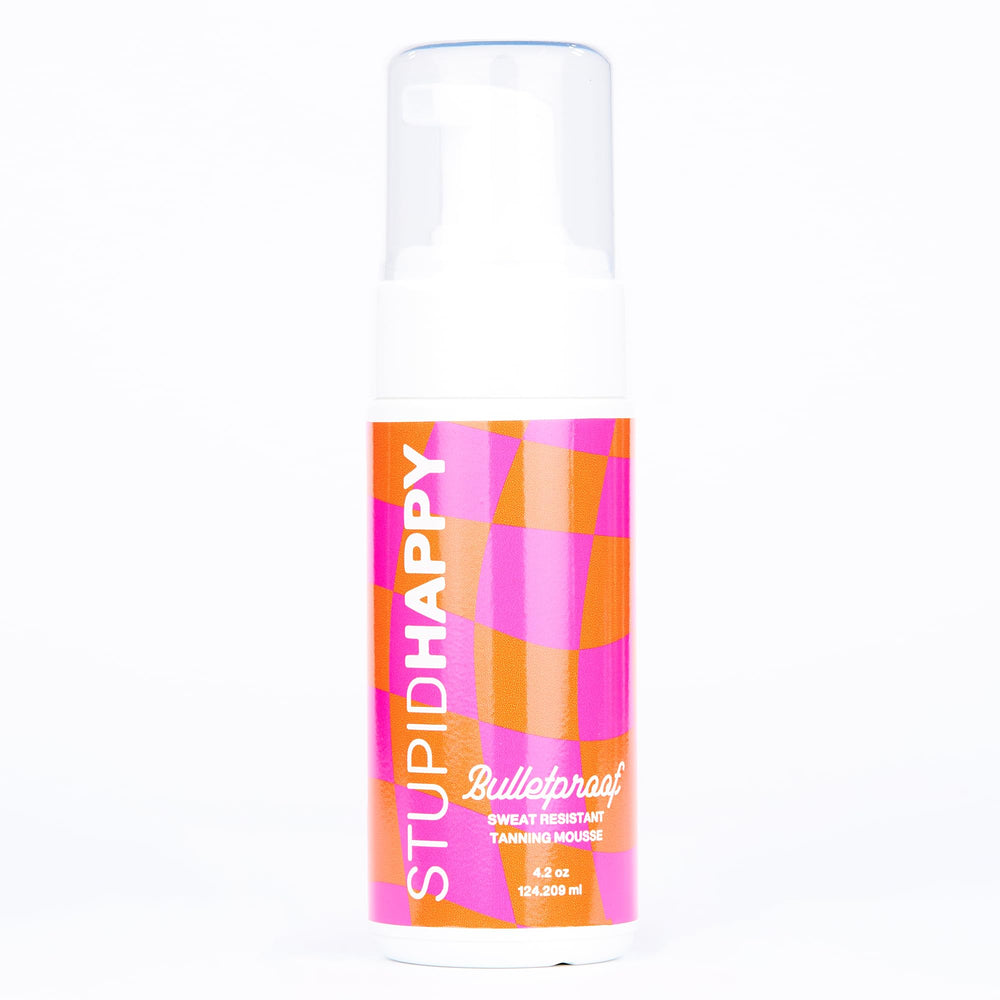 Stupid Happy self tanner mousse bottle display shows natural medium tan