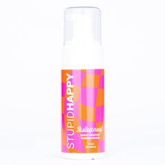 Stupid Happy self tanner mousse bottle display shows natural medium tan