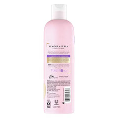 Suave Luscious Curls Conditioner closeup texture highlights moisture and smoothness for defined curls