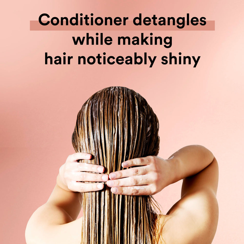 Suave Moroccan Oil Infusion conditioner close-up highlights lightweight hydration.