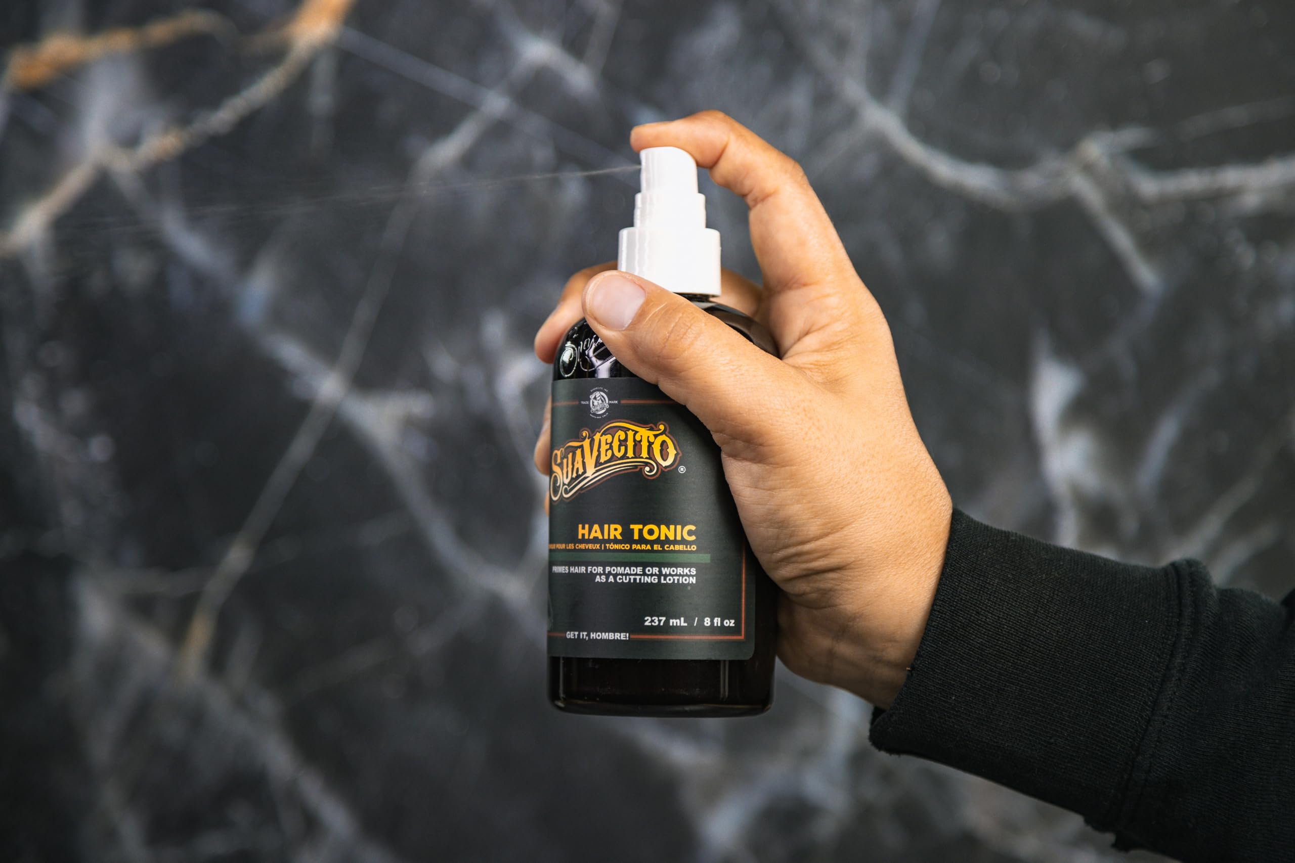 Suavecito Hair Tonic used as cutting agent on damp hair for smooth cuts
